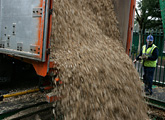 Woodfuel pouring out of lorry
