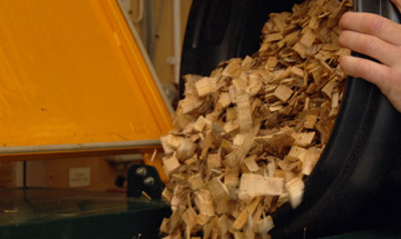 Feeding wood chip by hand