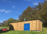 Timber clad boiler house and trees